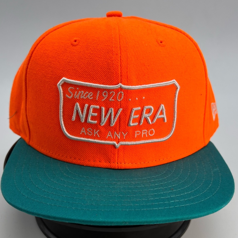 New Era SnapBack. Orange and Aqua blue. Gently used